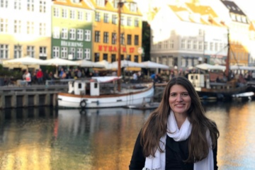 Allie in Copenhagen in front of boats