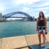 Allie in front of Sydney Harbor Bridge in Australia