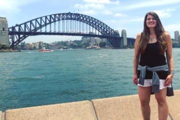 Allie in front of Sydney Harbor Bridge in Australia